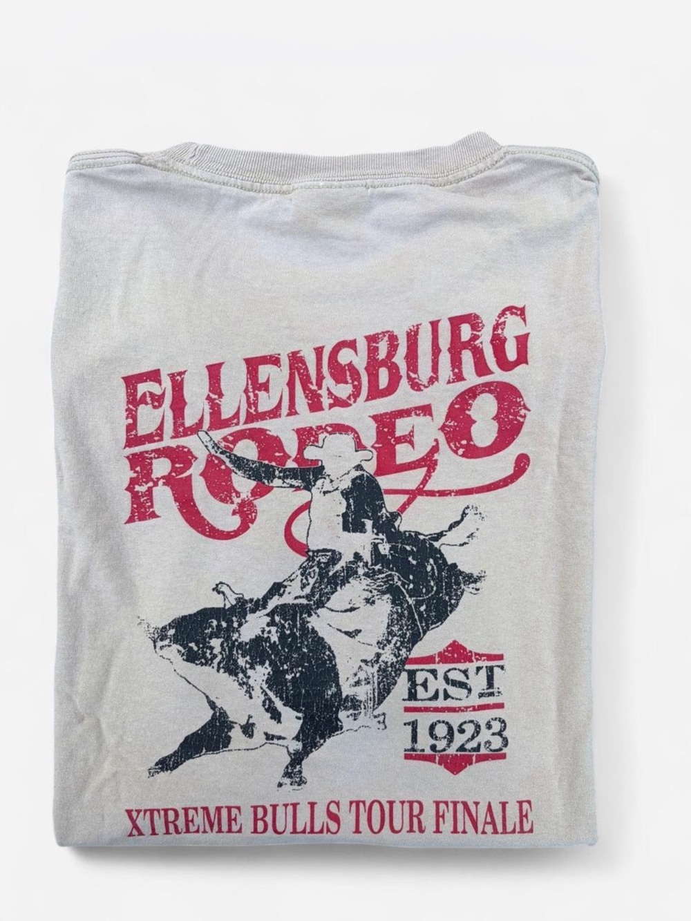 Rodeo Men’s Sz. L Tshirt in tan with black + red graphic of a cowboy amd bull